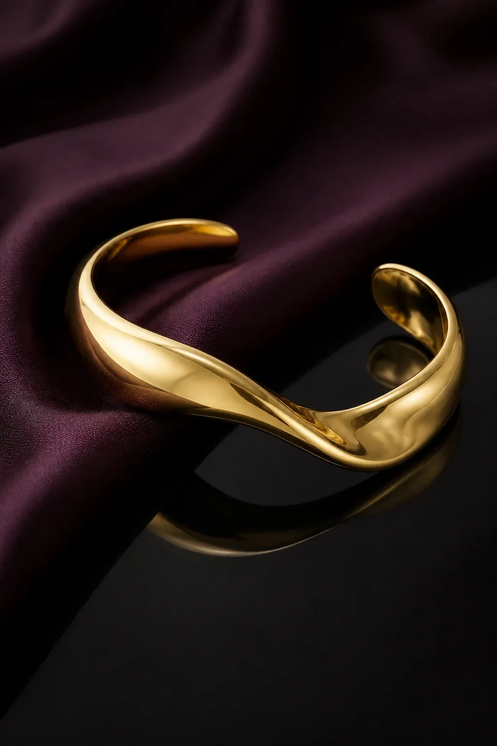 Élan sculptural open gold cuff on aubergine silk